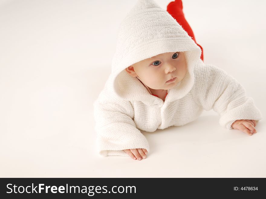 A baby in white hood
