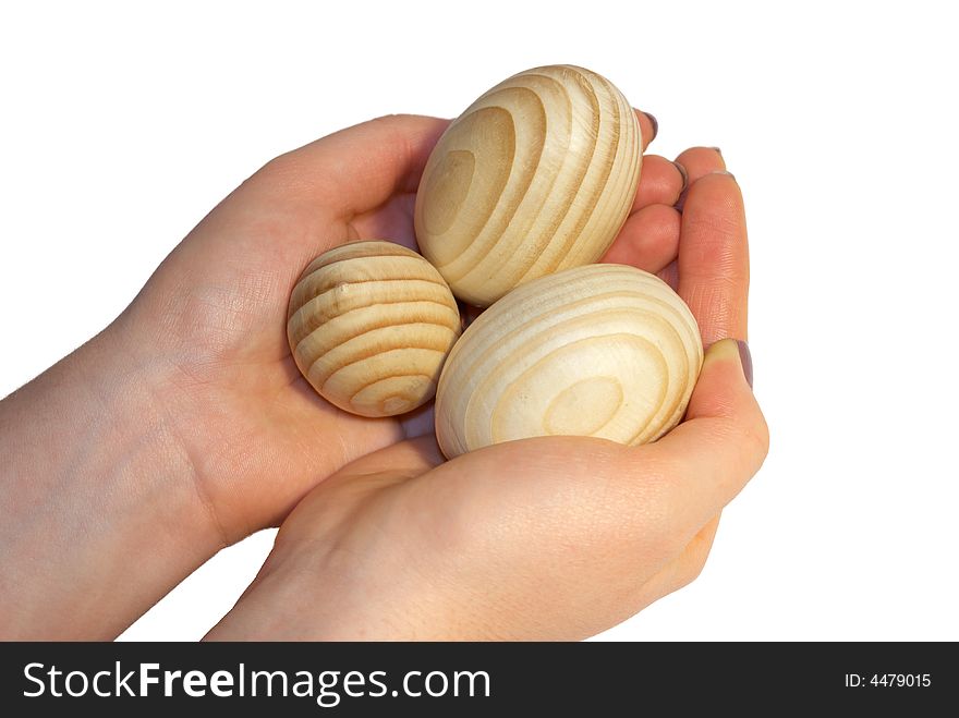 Wooden easter eggs on female palms