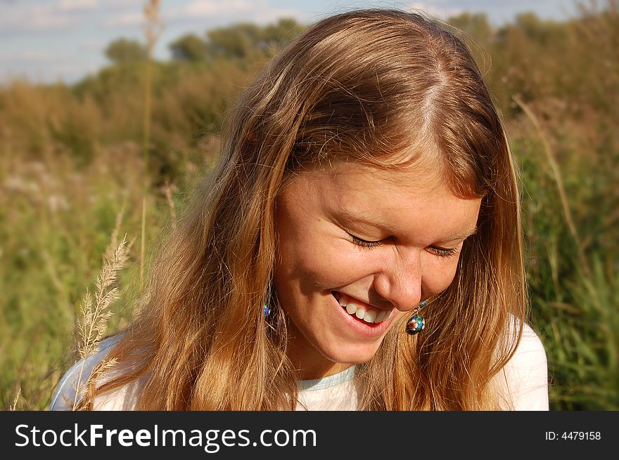 Laughing girl in the field