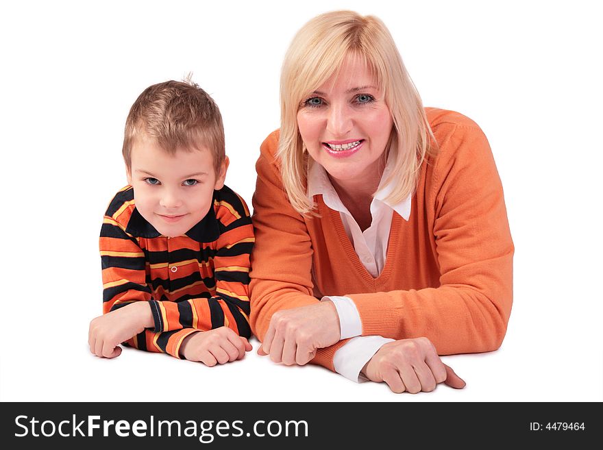 Middleaged woman with boy lying on white