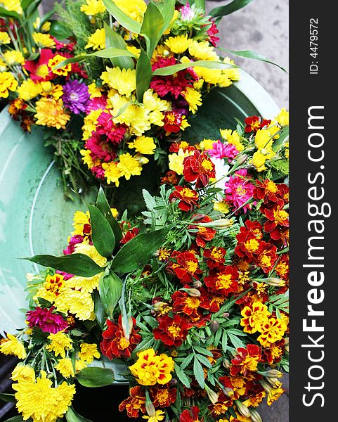 Colorful bunches of flowers for sale at a market.