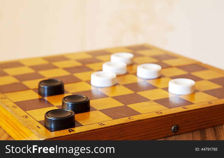 Black and white checkers on a chess board closeup