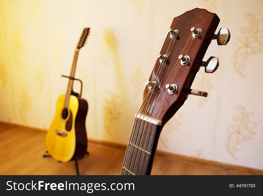 Head of acoustic six-string guitar closeup