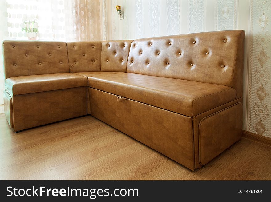 Brown leather sofa in a room closeup