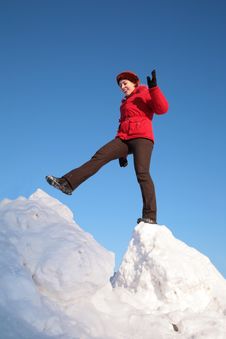 Woman Steps From One Snowy Chunk To Another Stock Photography Woman Steps From One Snowy Chunk To Another Stock Photography
