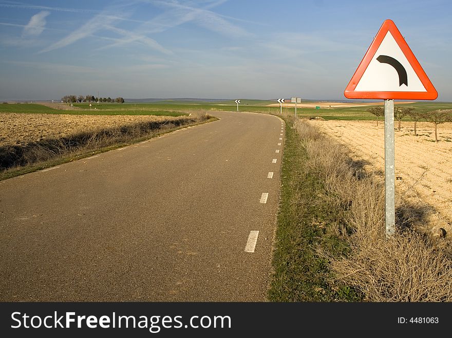 Signal of dangerous curve in a remote road