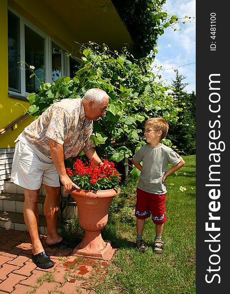 Grandfather and grandson in summer day