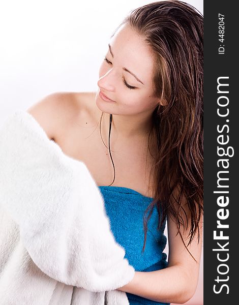Young woman is dreaming with a towel in her hand. Young woman is dreaming with a towel in her hand