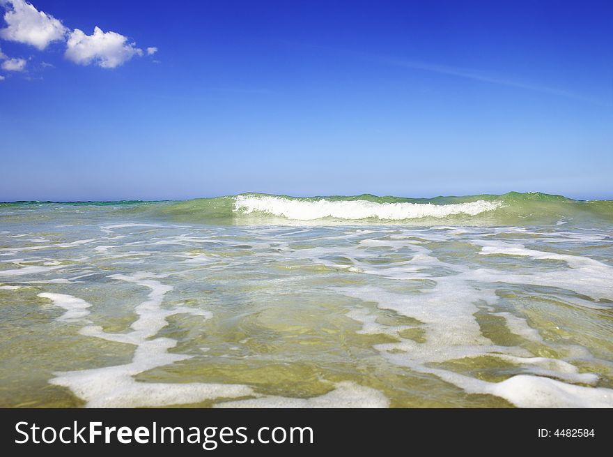 Waves on tropical beach with clear sky. Waves on tropical beach with clear sky