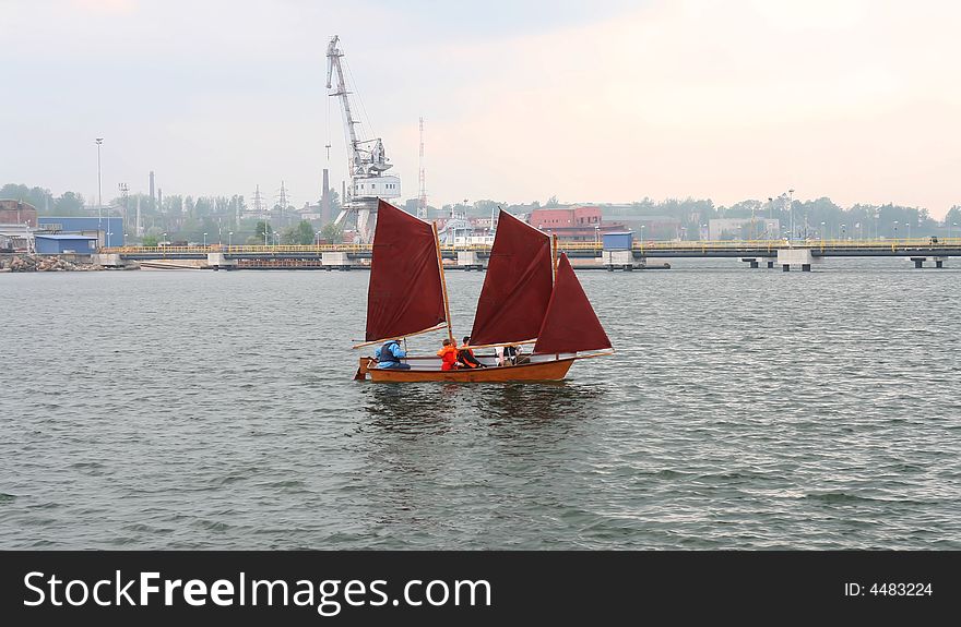 Sailing Vessel Floating In A Bay Of Port.