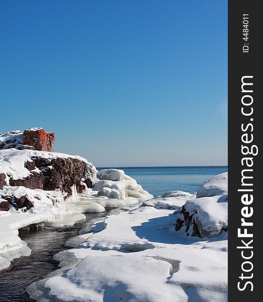 Frozen Mountain river running into Lake Superior. Frozen Mountain river running into Lake Superior