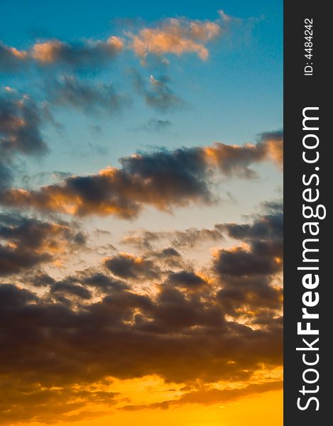 Beautiful skyscape background with dark blues and bright oranges. Beautiful skyscape background with dark blues and bright oranges