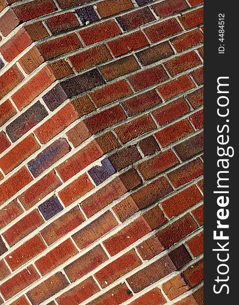 Diagnal view of a red brick wall