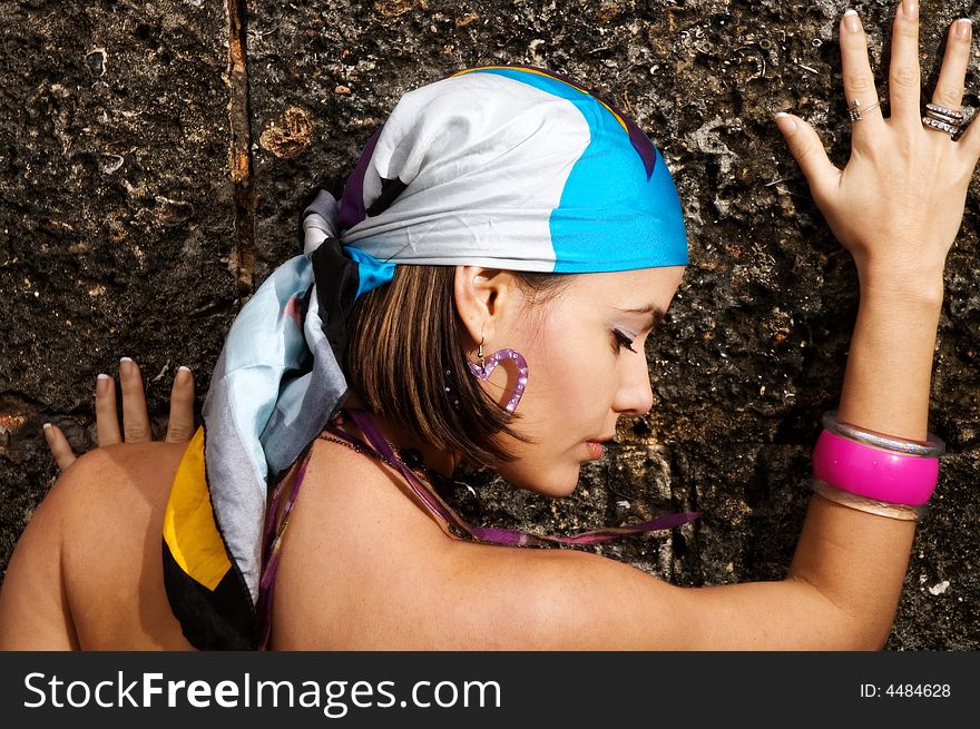 Portrait of young beauty against grungy wall. Portrait of young beauty against grungy wall