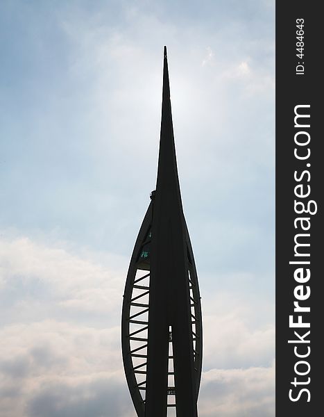 This stock photo depicts a silhouette of the upper portion of the Millenium Spinnaker Tower in Portsmouth, England. The Spinnaker Tower soars 170 meters (557 feet) into the sky above the historic harbour of Portsmouth, gateway to the English Channel.The Tower is a recent addition to the Portsmith city skyline. It can be found in the recently redeveloped area known as Gunwharf Quays. This stock photo depicts a silhouette of the upper portion of the Millenium Spinnaker Tower in Portsmouth, England. The Spinnaker Tower soars 170 meters (557 feet) into the sky above the historic harbour of Portsmouth, gateway to the English Channel.The Tower is a recent addition to the Portsmith city skyline. It can be found in the recently redeveloped area known as Gunwharf Quays.