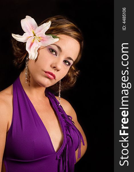 Portrait of beautiful female with lily flower on head. Portrait of beautiful female with lily flower on head