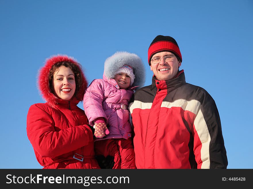 Mother with father hold child on the hands in winter. Mother with father hold child on the hands in winter