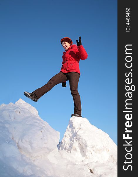 Woman Steps From One Snowy Chunk To Another