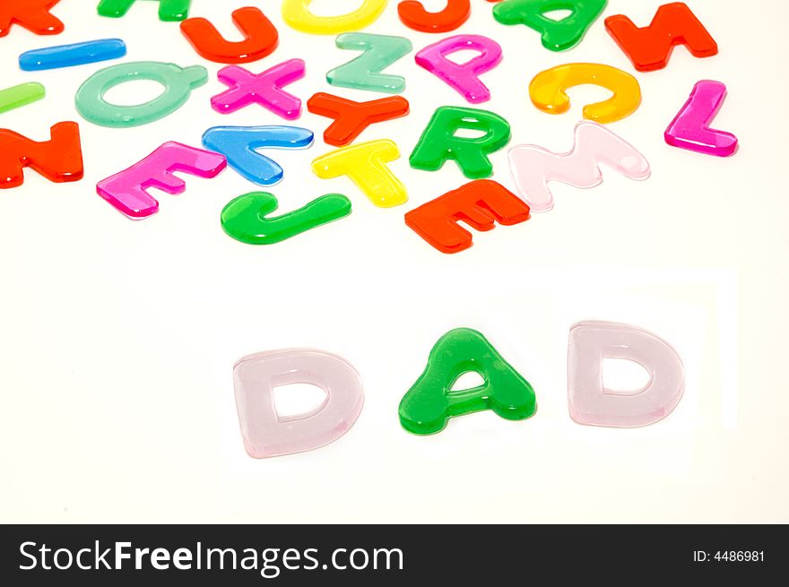 Color gel alphabet letters and word DAD. Isolated on white