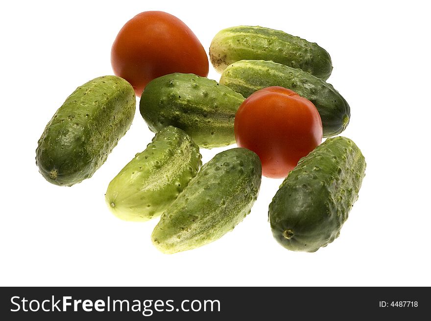 Tomato with cucumber isolated on the white background