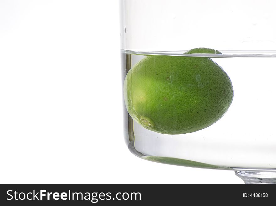 Fresh lemon splash into water on the white background