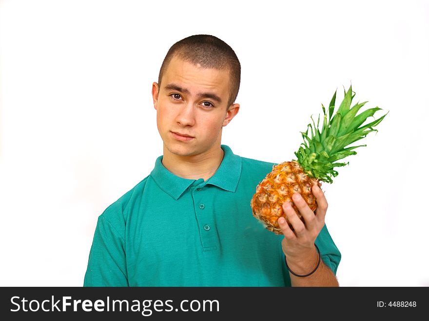 Boy with big orange-green pineapple. Boy with big orange-green pineapple