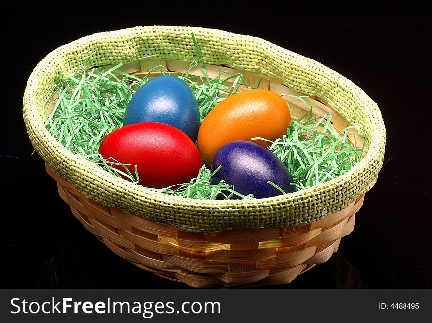 The Easter eggs are standing in basket. The Easter eggs are standing in basket