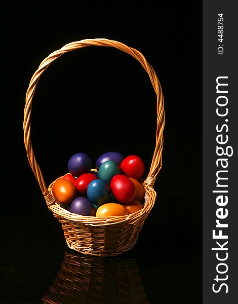 The Easter eggs are standing in basket. The Easter eggs are standing in basket