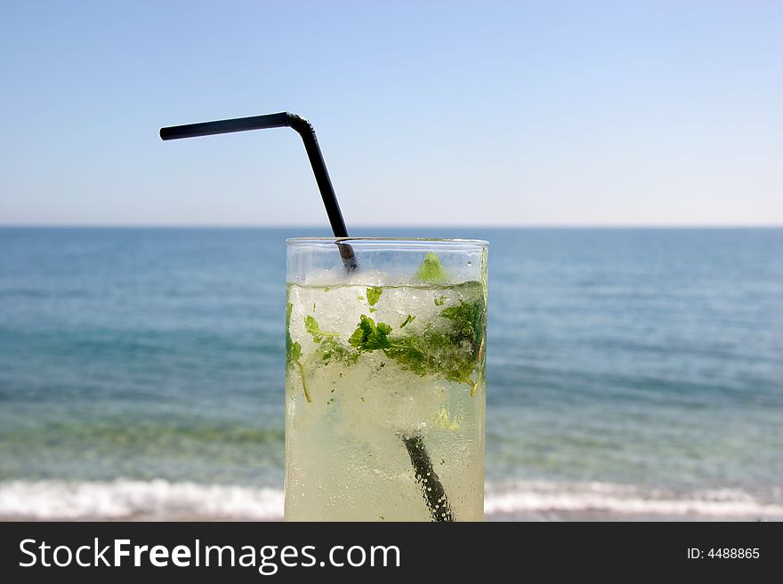 A refreshing mojito by the sea. A refreshing mojito by the sea