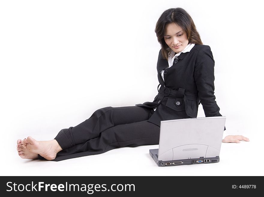 An Asian beautiful girl with confident with laptop and agenda book - isolated on white. An Asian beautiful girl with confident with laptop and agenda book - isolated on white