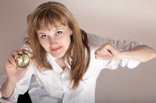 A Nice Girl With Alarm-clock Royalty Free Stock Images
