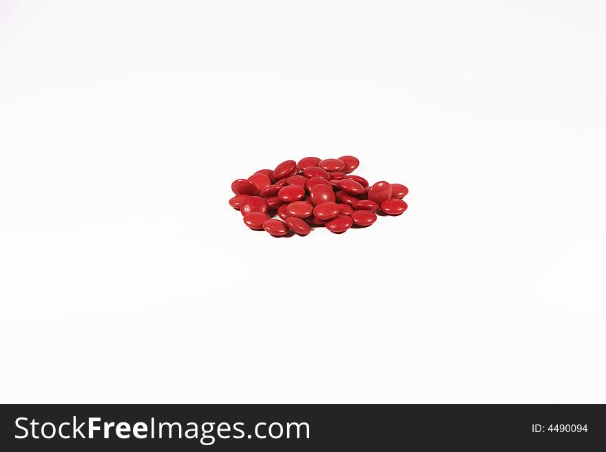 Red pills isolated on white background