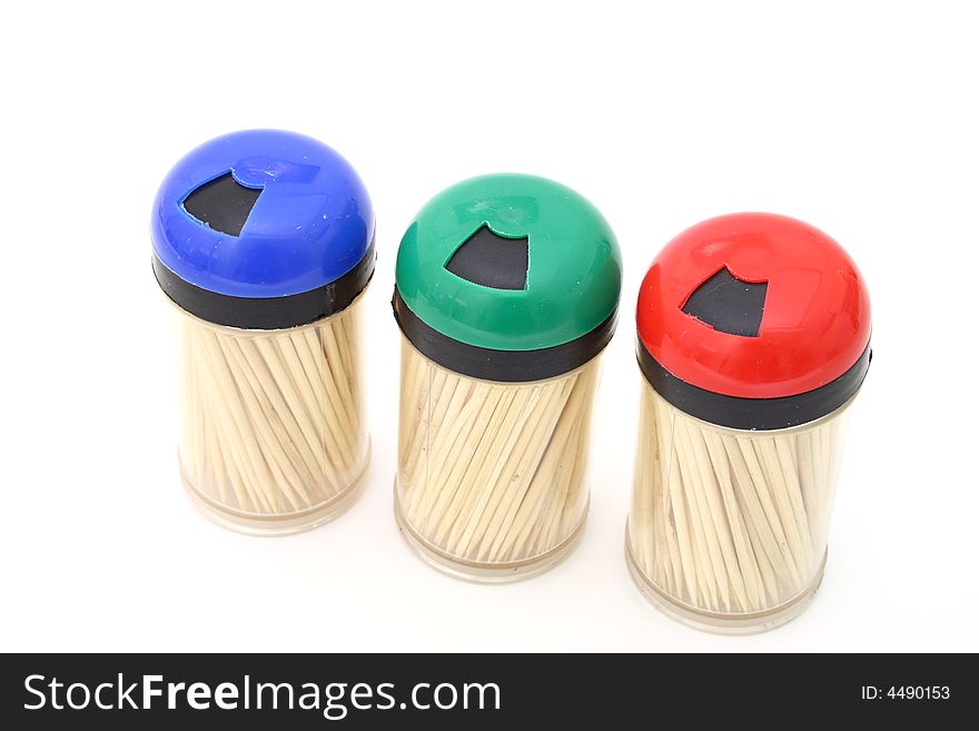 Three toothpick bottles on a white surface. Three toothpick bottles on a white surface