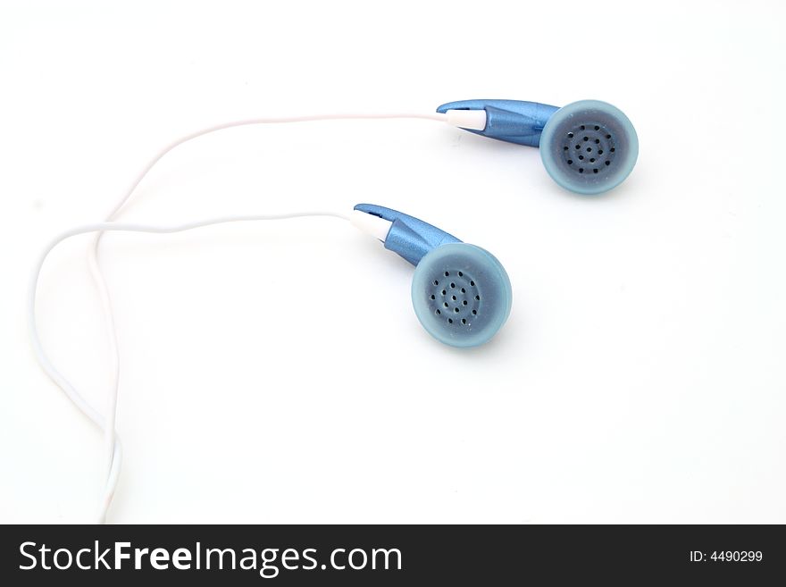 Blue ear phones over a white surface. Blue ear phones over a white surface