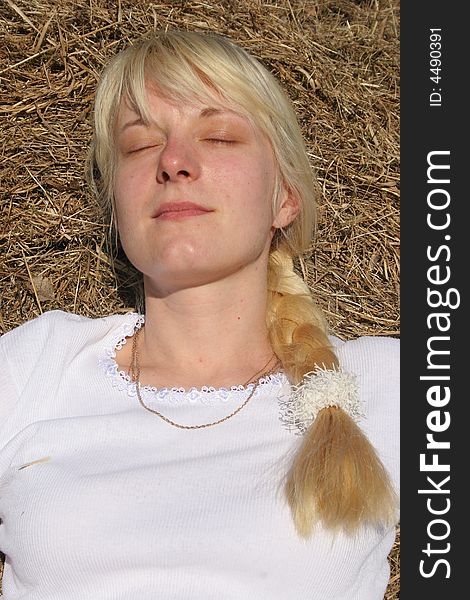 Portrait of a blond girl in the hay. Portrait of a blond girl in the hay