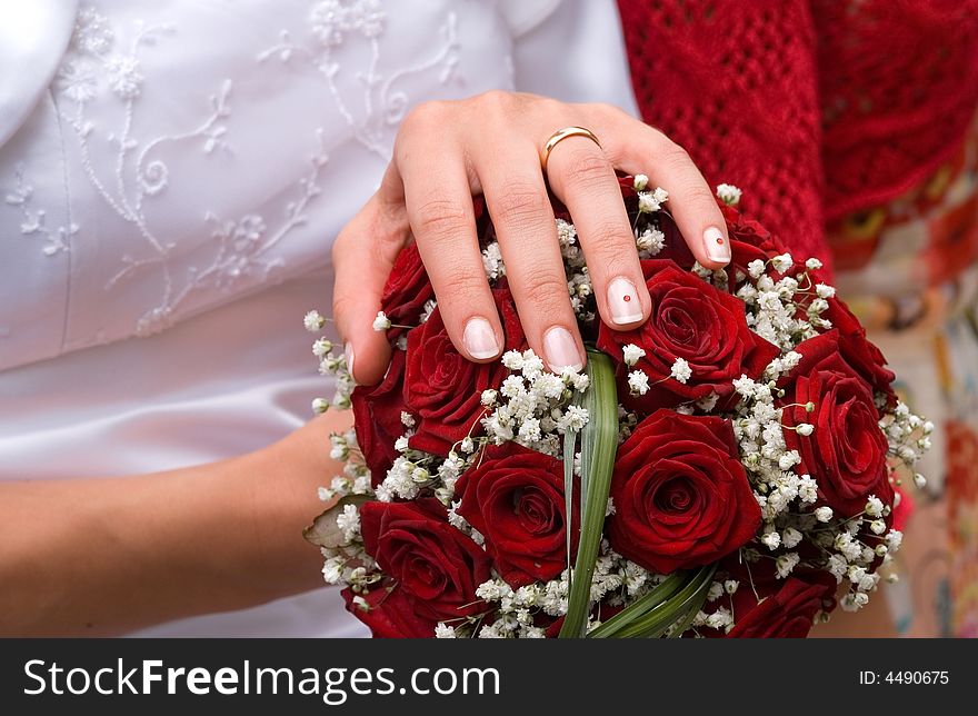 Bride, showing her hand with wedding ring. Bride, showing her hand with wedding ring.