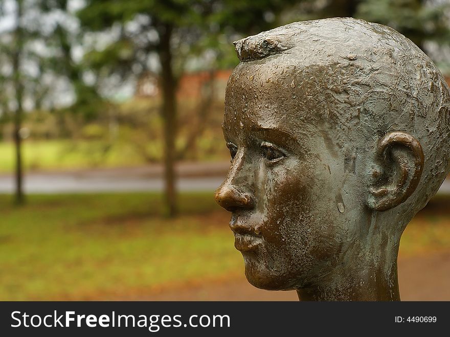 Statue of boy in the rain. Statue of boy in the rain