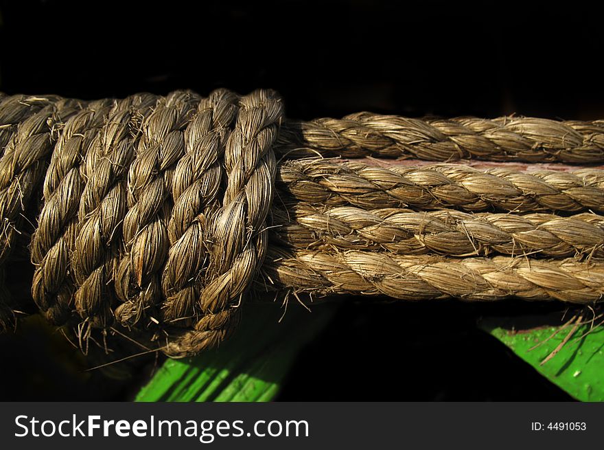 Old rope on black background