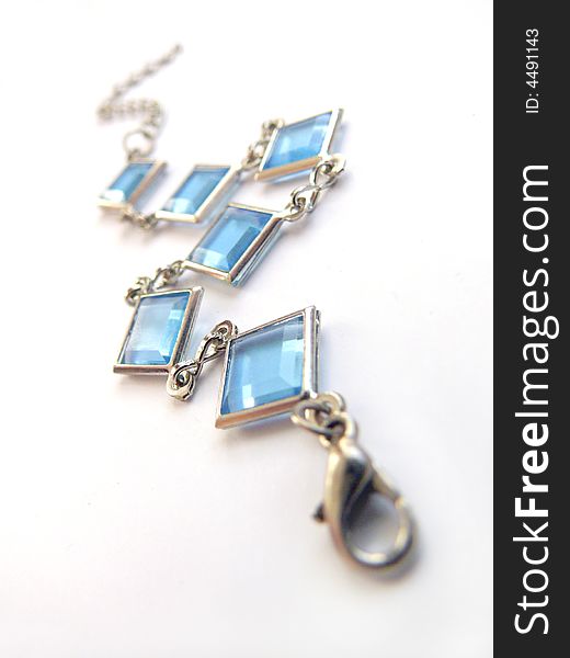 Isolated silver blue gem. Jewel on white background.