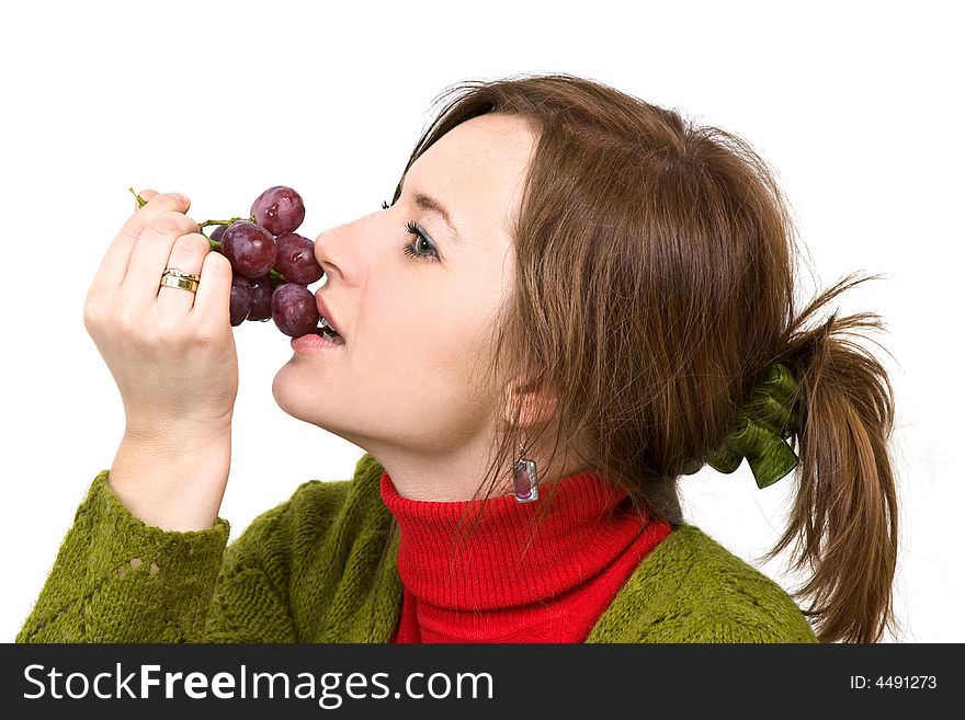 Young girl is holding grapes in the palm