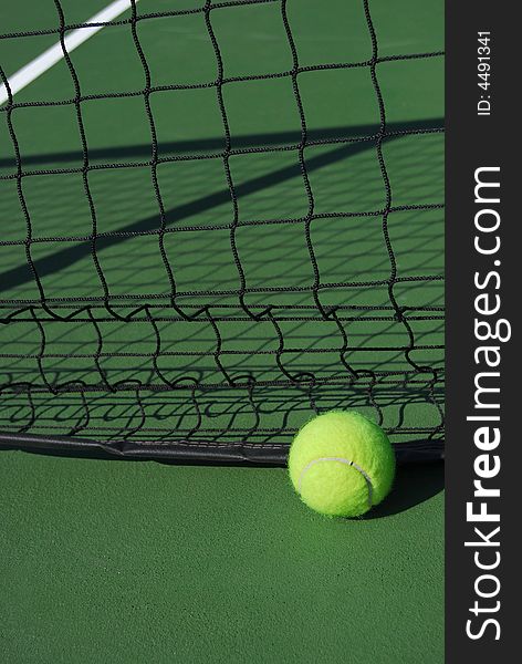 Tennis ball at the net