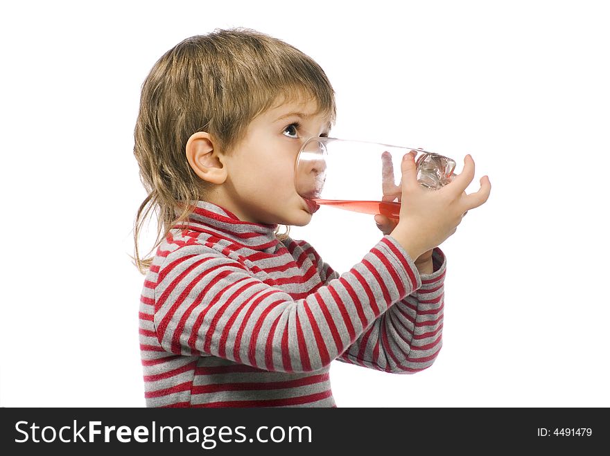 Little boy drinks juice on the white background. Little boy drinks juice on the white background