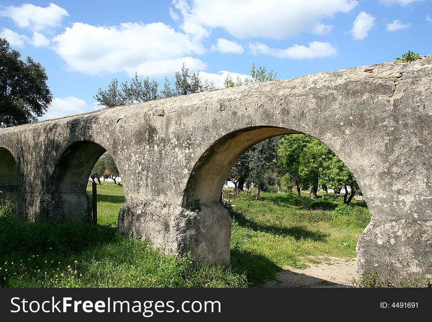 Roman bridge in the field, historical places in portugal