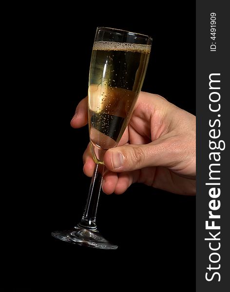 Hand taking a champagne glass. Black background. Hand taking a champagne glass. Black background.