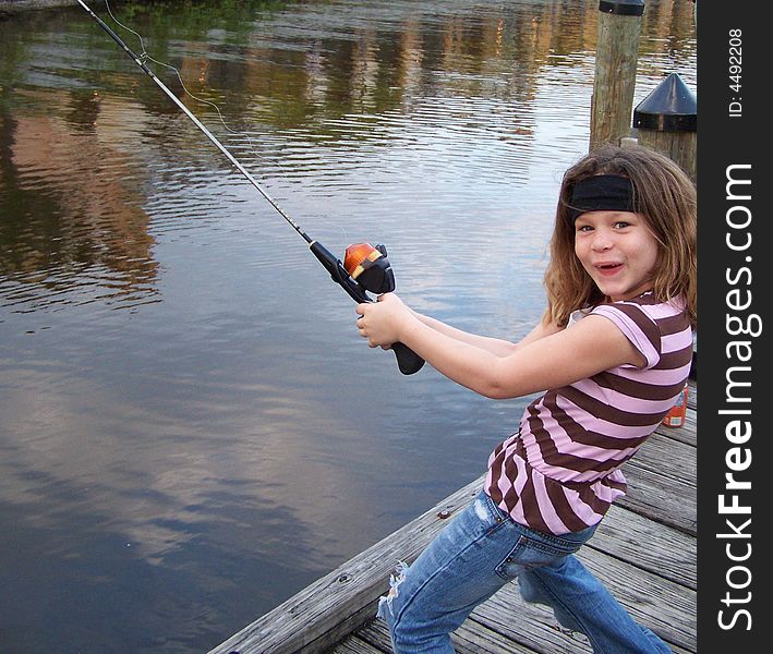 Jazzy having a blast and acting silly while fishing off dock at St. Lucie River. Jazzy having a blast and acting silly while fishing off dock at St. Lucie River