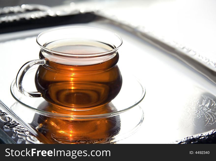 Transparent Cup Of Tea On The Salver