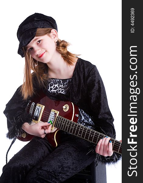 Preteen playing her electric guitar.  Isolated on white. Preteen playing her electric guitar.  Isolated on white.