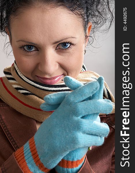 An image of a nice girl in blue gloves