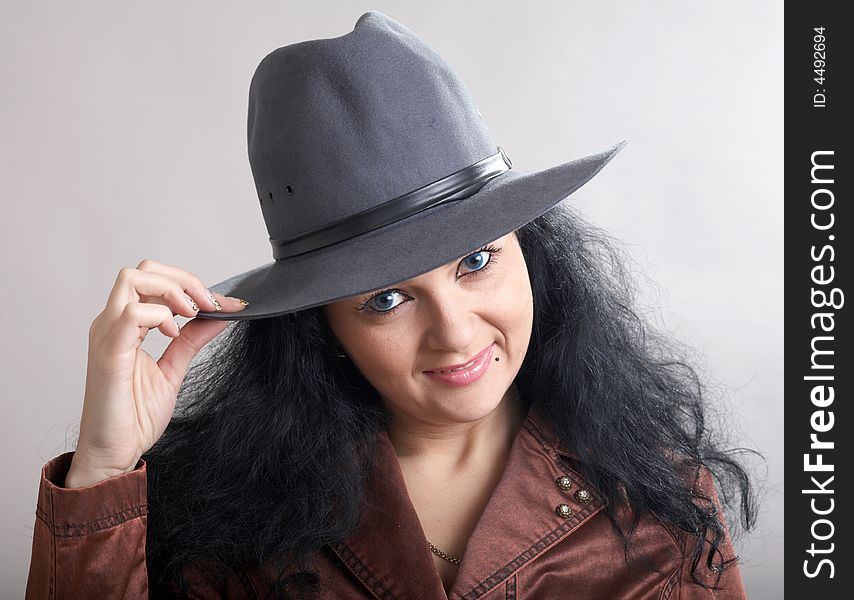 An image of a beautiful woman in felt hat. An image of a beautiful woman in felt hat