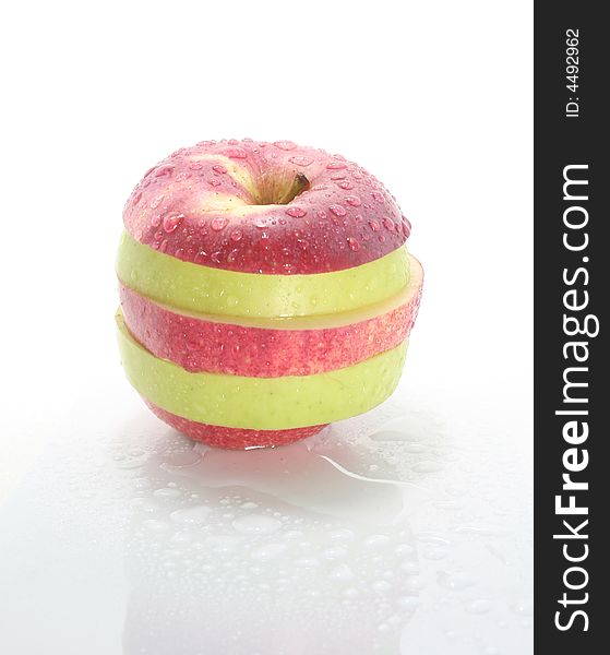 Wet striped apple on a white background